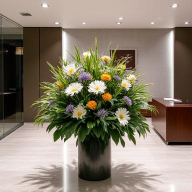 An elegant floral arrangement in a modern corporate lobby.